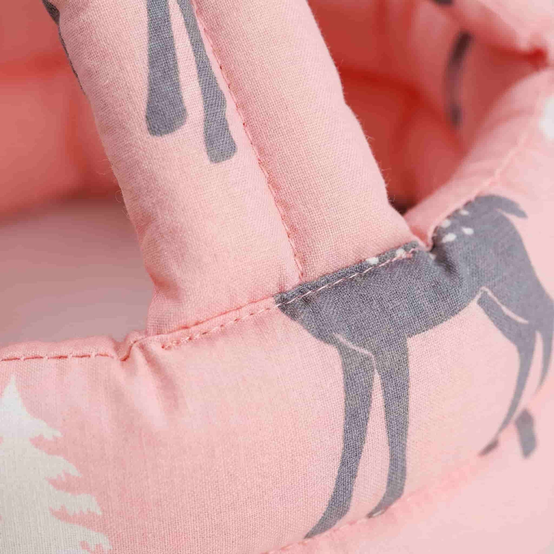 Close-up macro shot of the breathable cotton fabric and high-quality stitching on the SafePlay baby head protector helmet.